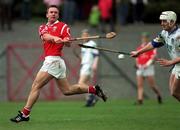 27 March 1999; Dan Murphy of Cork in action against Fergal Hartley of Waterford during the Church and General National Hurling League Division 1B match between Cork and Waterford at Páirc Uí Rinn in Cork. Photo by Brendan Moran/Sportsfile