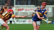 28 March 1999; Eddie Tucker of Tipperary in action against Johnny Butler of Kilkenny during the Church and General National Hurling League Division 1B match between Kilkenny and Tipperary at Nowlan Park in Kilkenny. Photo by Matt Browne/Sportsfile