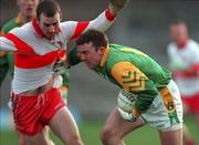 28 February 1999; Evan Kelly of Meath in action against David O'Neill of Derry during the Church and General National Football League Division 1 match between Meath and Derry at Páirc Tailteann in Navan, Meath. Photo by Ray McManus/Sportsfile