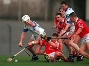 27 March 1999; Fergal Hartley of Waterford is tackled by Diarmuid O'Sullivan of Cork during the Church and General National Hurling League Division 1B match between Cork and Waterford at Páirc Uí Rinn in Cork. Photo by Damien Eagers/Sportsfile