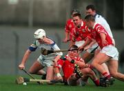 27 March 1999; Fergal Hartley of Waterford is tackled by Diarmuid O'Sullivan during the Church and General National Hurling League Division 1B match between Cork and Waterford at Páirc Uí Rinn in Cork. Photo by Damien Eagers/Sportsfile