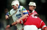 27 March 1999; Fergal Hartley of Waterford is tackled by Timmy McCarthy, centre, and Diarmuid O'Sullivan of Cork during the Church and General National Hurling League Division 1B match between Cork and Waterford at Páirc Uí Rinn in Cork. Photo by Damien Eagers/Sportsfile