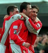 14 March 1999; Kelvin Flanagan of Cork City celebrates with team-mates Pat Morley, left, and Gerald Dobbs, right, after his shot deflected off Padraig Gollogley of Dundalk for their side's first goal during the Harp Lager National League Premier Division match between Cork City and Dundalk in Turners Cross in Cork. Photo by David Maher/Sportsfile