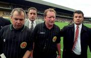 22 August 1998; Referee Jimmy Cooney, having blown the full-time whistle early, is escorted from the pitch by linesman Aodan Mac Suibhne, left, and Croke Park security staff after the Guinness All-Ireland Hurling All-Ireland Senior Championship Semi-Final Replay match between Clare and Offaly at Croke Park in Dublin. Photo by David Maher/Sportsfile