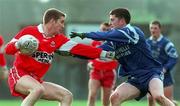 14 February 1999; Joseph Cassidy of Derry in action against Padraig McKenna of Monaghan during the Church and General National Football League Division 1 match between Derry and Monaghan at Celtic Park in Derry. Photo by Ray Lohan/Sportsfile