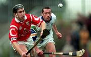 27 March 1999; Kieran Morrisson of Cork in action against Peter Queally of Waterford during the Church and General National Hurling League Division 1B match between Cork and Waterford at Páirc Uí Rinn in Cork. Photo by Brendan Moran/Sportsfile