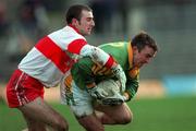 28 February 1999; Evan Kelly of Meath in action against David O'Neill of Derry during the Church and General National Football League Division 1 match between Meath and Derry at Páirc Tailteann in Navan, Meath. Photo by Ray McManus/Sportsfile