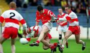 11 April 1999; Mark O'Sullivan of Cork scores one of his side's three goals during the Church and General National Football League Quarter-Final match between Cork and Derry at Croke Park in Dublin. Photo by Damien Eagers/Sportsfile