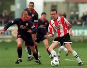 14 February 1999; Michael McHugh of Derry City in action against Stephen McGuinness of St Patrick's Athletic during the Harp Lager National League Premier Division match between Derry City and St Patrick's Athletic at The Brandywell Stadium in Derry. Photo by David Maher/Sportsfile