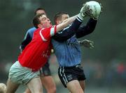 28 March 1999; Michael O'Donovan of Cork contests a ball with Mick O'Keeffe of Dublin during the Church and General National Football League Division 1 match between Cork and Dublin at Páirc Uí Rinn in Cork. Photo by Brendan Moran/Sportsfile
