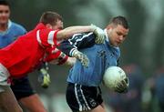 28 March 1999; Mick O'Keeffe of Dublin is tackled by Michael O'Donovan of Cork during the Church and General National Football League Division 1 match between Cork and Dublin at Páirc Uí Rinn in Cork. Photo by Brendan Moran/Sportsfile