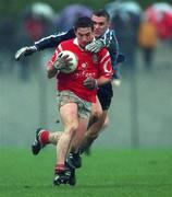 28 March 1999; Owen Sexton of Cork in action against Ciaran Whelan of Dublin during the Church and General National Football League Division 1 match between Cork and Dublin at Páirc Uí Rinn in Cork. Photo by Damien Eagers/Sportsfile