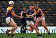 21 March 1999; Paul Ormode of Tipperary in action against Darragh Ryan, left, and Rory McCarthy of Wexford during the Church and General National Hurling League Division 1B match between Tipperary and Wexford at Semple Stadium in Thurles, Tipperary. Photo by Ray McManus/Sportsfile