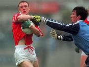 28 March 1999; Philip Clofford of Cork in action against Paddy Christie of Dublin during the Church and General National Football League Division 1 match between Cork and Dublin at Páirc Uí Rinn in Cork. Photo by Brendan Moran/Sportsfile