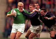 20 March 1999; Rob Henderson of Ireland is tackled by Glenn Metcalfe and Gary Anderson, right, of Scotland during the Five Nations Rugby Championship match between Scotland and Ireland in Murrayfield Stadium in Edinburgh, Scotland. Photo by Matt Browne/Sportsfile