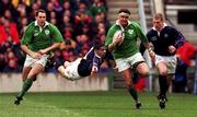 20 March 1999; Dion O Cuinneagain of Ireland beats the tackle of Scott Murray of Scotland during the Five Nations Rugby Championship match between Scotland and Ireland in Murrayfield Stadium in Edinburgh, Scotland. Photo by Matt Browne/Sportsfile