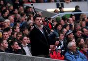 20 March 1999; A Scotland rugby fan plays the bagpipes during the Five Nations Rugby Championship match between Scotland and Ireland in Murrayfield Stadium in Edinburgh, Scotland. Photo by Brendan Moran/Sportsfile