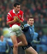 28 March 1999; Sean Og O hAilpin of Cork in action against Dessie Farrell of Dublin during the Church and General National Football League Division 1 match between Cork and Dublin at Páirc Uí Rinn in Cork. Photo by Brendan Moran/Sportsfile