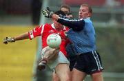 28 March 1999; Shane Ryan of Dublin attempts to block a shot by Mark O'Sullivan of Cork during the Church and General National Football League Division 1 match between Cork and Dublin at Páirc Uí Rinn in Cork. Photo by Damien Eagers/Sportsfile