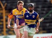 21 March 1999; Thomas Dunne of Tipperary in action against Ger Cushe of Wexford during the Church and General National Hurling League Division 1B match between Tipperary and Wexford at Semple Stadium in Thurles, Tipperary. Photo by Damien Eagers/Sportsfile