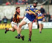 28 March 1999; Thomas Dunne of Tipperary in action against Charlie Carter of Kilkenny during the Church and General National Hurling League Division 1B match between Kilkenny and Tipperary at Nowlan Park in Kilkenny. Photo by Matt Browne/Sportsfile
