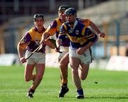 21 March 1999; William Maher of Tipperary in action against Rory cCarthy, left, and Declan Ruth of Wexford during the Church and General National Hurling League Division 1B match between Tipperary and Wexford at Semple Stadium in Thurles, Tipperary. Photo by Damien Eagers/Sportsfile