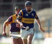 21 March 1999; William Maher of Tipperary in action against Rory McCarthy of Wexford during the Church and General National Hurling League Division 1B match between Tipperary and Wexford at Semple Stadium in Thurles, Tipperary. Photo by Damien Eagers/Sportsfile