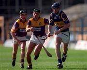 21 March 1999; William Maher of Tipperary in action against Rory McCarthy, left, and Declan Ruth of Wexford during the Church and General National Hurling League Division 1B match between Tipperary and Wexford at Semple Stadium in Thurles, Tipperary. Photo by Damien Eagers/Sportsfile