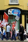 5 June 2005; Vendors sell flags and scarfs in Clones before the match. Bank of Ireland Ulster Senior Football Championship, Monaghan v Derry, St. Tighernach's Park, Clones, Co. Monaghan. Picture credit; Damien Eagers / SPORTSFILE