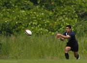 14 June 2005; Scrum-half Kieran Campbell passes the ball during training. Ireland rugby squad training, Tatsumi No Mori Rugby training facility, Tokyo, Japan. Picture credit; Brendan Moran / SPORTSFILE