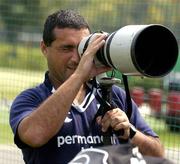 14 June 2005; Assistant coach Michael Bradley looks through a camera lens during training. Ireland rugby squad training, Tatsumi No Mori Rugby training facility, Tokyo, Japan. Picture credit; Brendan Moran / SPORTSFILE