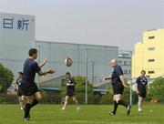 14 June 2005; Flanker Denis Leamy, left, receives a pass from Bernard Jackman, watched by head coach Niall O'Donovan during training. Ireland rugby squad training, Tatsumi No Mori Rugby training facility, Tokyo, Japan. Picture credit; Brendan Moran / SPORTSFILE