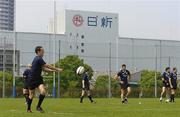 14 June 2005; Centre Kieran Lewis passes the ball during training. Ireland rugby squad training, Tatsumi No Mori Rugby training facility, Tokyo, Japan. Picture credit; Brendan Moran / SPORTSFILE