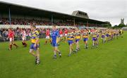 12 June 2005; The Clare and Cork football teams take part in the pre-match parade. Bank of Ireland Munster Senior Football Championship Semi-Final, Clare v Cork, Cusack Park, Ennis, Co. Clare. Picture credit; Kieran Clancy / SPORTSFILE