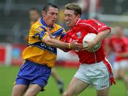 12 June 2005; Conor McCarthy, Cork, in action against  Alan Clohessy, Clare. Bank of Ireland Munster Senior Football Championship Semi-Final, Clare v Cork, Cusack Park, Ennis, Co. Clare. Picture credit; Kieran Clancy / SPORTSFILE