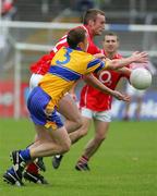 12 June 2005; Nicolas Murphy, Cork, in action against Kevin Dilleen, Clare. Bank of Ireland Munster Senior Football Championship Semi-Final, Clare v Cork, Cusack Park, Ennis, Co. Clare. Picture credit; Kieran Clancy / SPORTSFILE