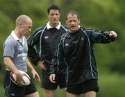 15 June 2005; Captain David Humphreys, right, makes a point to scrum-half Peter Stringer, left, as centre David Quinlan looks on during training. Ireland rugby squad training, Tatsumi No Mori Rugby training facility, Tokyo, Japan. Picture credit; Brendan Moran / SPORTSFILE