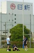 14 June 2005; Flanker Alan Quinlan gets ready for training watched by team physiotherapist Cameron Steele, left, and team manager Joe Miles. Ireland rugby squad training, Tatsumi No Mori Rugby training facility, Tokyo, Japan. Picture credit; Brendan Moran / SPORTSFILE