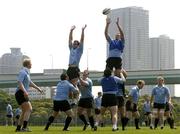 17 June 2005; Alan Quinlan wins a lineout from Matt McCullough during training in front of a backdrop of Tokyo city. Ireland rugby squad training, Tatsumi No Mori Rugby training facility, Tokyo, Japan. Picture credit; Brendan Moran / SPORTSFILE
