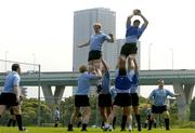 17 June 2005; Trevor Hogan wins a lineout from Eric Miller during training in front of a backdrop of Tokyo city. Ireland rugby squad training, Tatsumi No Mori Rugby training facility, Tokyo, Japan. Picture credit; Brendan Moran / SPORTSFILE