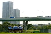17 June 2005; The Irish team are spoken to by assistant coach Mark McCall during training as traffic passes by on a highway through Tokyo city. Ireland rugby squad training, Tatsumi No Mori Rugby training facility, Tokyo, Japan. Picture credit; Brendan Moran / SPORTSFILE
