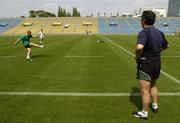 18 June 2005; Ireland out-half David Humphreys practices his kicking at the match venue under the watchful eye of kicking coach Mark Tainton. Ireland kicking practice, Prince Chichibu Memorial Rugby Ground, Tokyo, Japan. Picture credit; Brendan Moran / SPORTSFILE