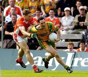 18 June 2005; Brendan Devenney, Donegal, in action against Kieran McGeaney, Armagh. Bank of Ireland Ulster Senior Football Championship Replay, Armagh v Donegal, St. Tighernach's Park, Clones, Co. Monaghan. Picture credit; Pat Murphy / SPORTSFILE