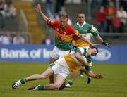 18 June 2005; Ciaran McManus, Offaly, in action against Richard Sinnott, Carlow. Bank of Ireland All-Ireland Senior Football Championship Qualifier, Round 1, Carlow v Offaly, Dr. Cullen Park, Co. Carlow. Picture credit; Damien Eagers / SPORTSFILE