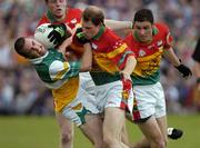 18 June 2005; James Keane, Offaly, in action against Carlow's, left to right, Richard Sinnott, Paul Cashin and Patrick Hickey. Bank of Ireland All-Ireland Senior Football Championship Qualifier, Round 1, Carlow v Offaly, Dr. Cullen Park, Co. Carlow. Picture credit; Damien Eagers / SPORTSFILE