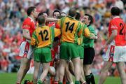 18 June 2005; The Donegal and Armagh players get involved in a tussle during the game. Bank of Ireland Ulster Senior Football Championship Replay, Armagh v Donegal, St. Tighernach's Park, Clones, Co. Monaghan. Picture credit; Oliver McVeigh / SPORTSFILE