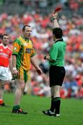 18 June 2005; Referee Maurice Deegan shows the red card to Donegal's Adrian Sweeney. Bank of Ireland Ulster Senior Football Championship Replay, Armagh v Donegal, St. Tighernach's Park, Clones, Co. Monaghan. Picture credit; Oliver McVeigh / SPORTSFILE