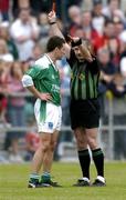 18 June 2005; Referee Mick McGrath shows the red card to Ryan McCloskey, Fermanagh, during the second half. Bank of Ireland All-Ireland Senior Football Championship Qualifier, Round 1, Down v Fermanagh, Pairc an Iuir, Newry, Co. Down. Picture credit; David Maher / SPORTSFILE