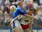 19 June 2005; Brendan Donnelly, Tyrone, in action against Pauric Reilly, Cavan. Bank of Ireland Ulster Senior Football Championship Semi-Final, Tyrone v Cavan, St. Tighernach's Park, Clones, Co. Monaghan. Picture credit; Pat Murphy / SPORTSFILE