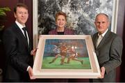7 February 2014; Former President of Ireland Mary McAleese and husband Martin are presented with a painting by artist Niall Laird, left. The Croke Park Hotel, Jones's Road, Dublin. Picture credit: Ramsey Cardy / SPORTSFILE
